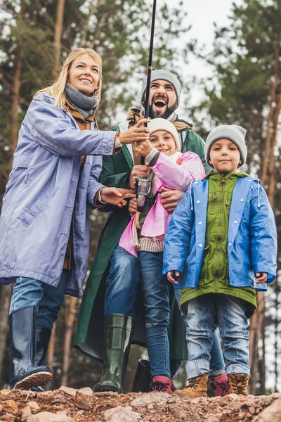 Family fishing together — Stock Photo