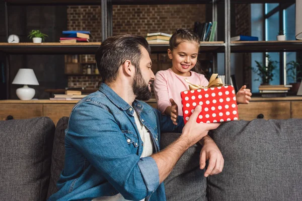 Father presenting gift for daughter — Stock Photo