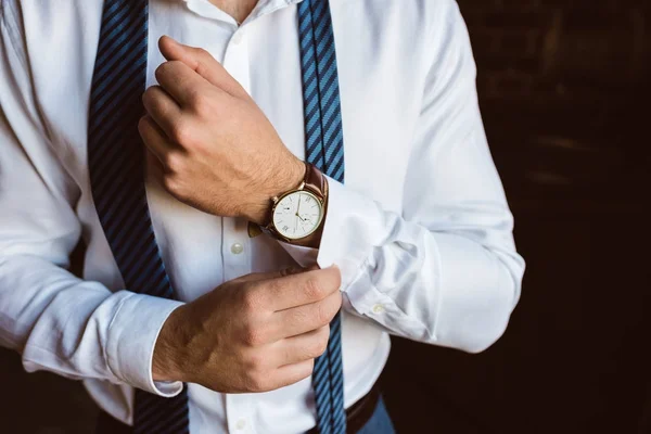 Fixing cufflink — Stock Photo