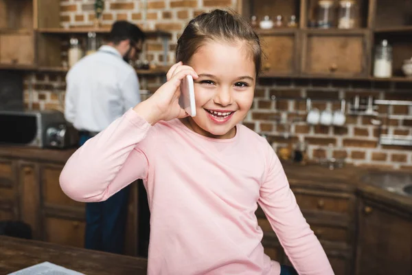 Child talking by phone — Stock Photo