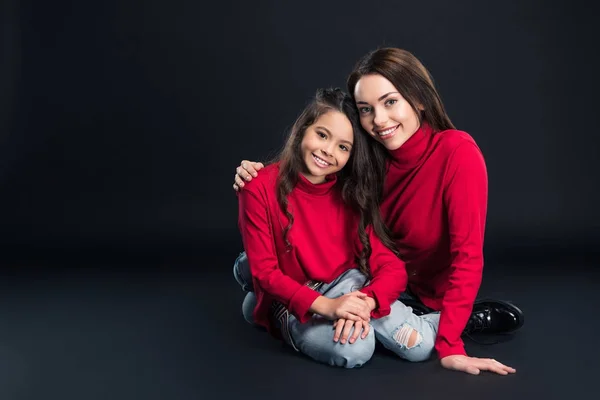 Mother hugging daughter — Stock Photo