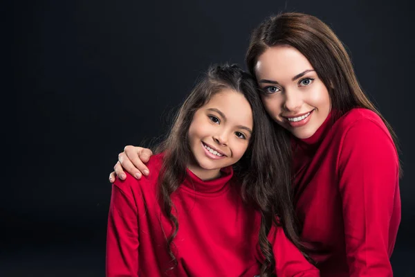 Mother hugging daughter — Stock Photo