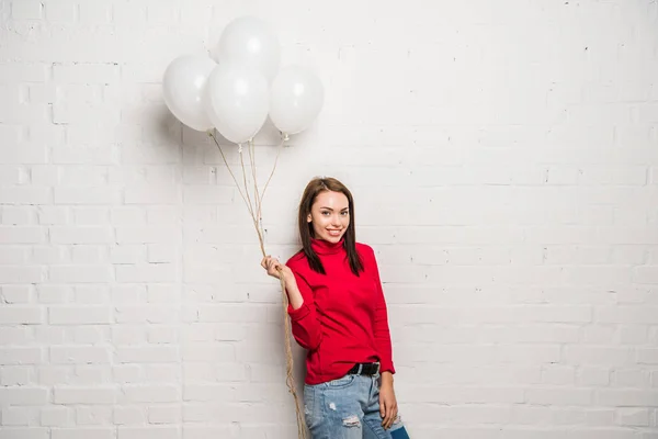 Woman with helium balloons — Stock Photo