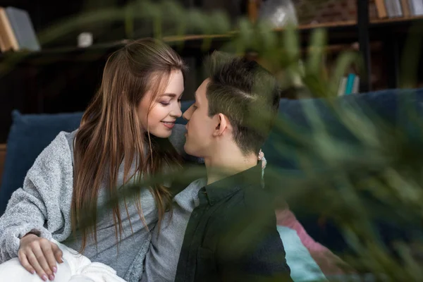 Couple going to kiss in bed in morning — Stock Photo