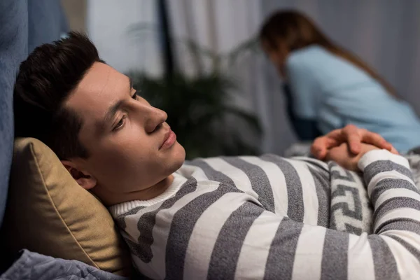 Frustrated upset couple on bed in bedroom — Stock Photo