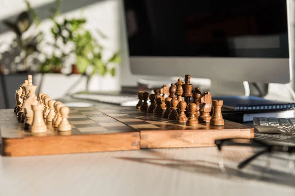 Close-up shot of chess board at office work desk — Stock Photo