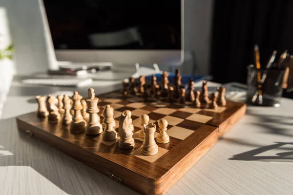 Close-up shot of chess board at office workplace — Stock Photo