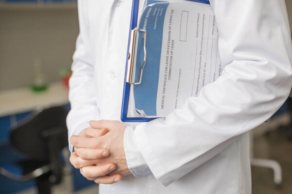 doctor holding diagnosis