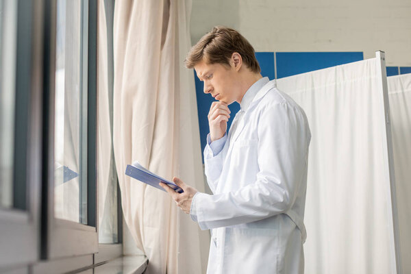 doctor holding diagnosis