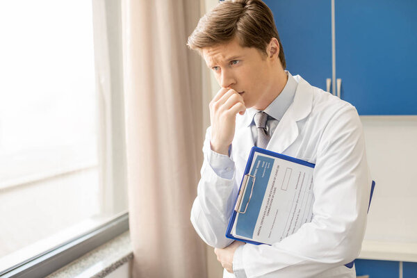 doctor holding diagnosis