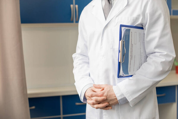 doctor holding diagnosis