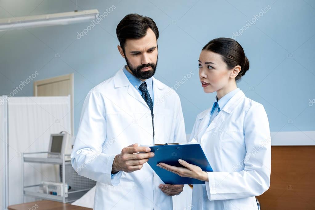 doctors holding diagnosis 
