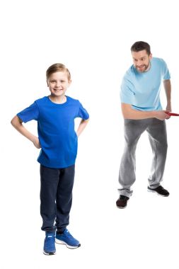 Father and son playing with frisbee clipart