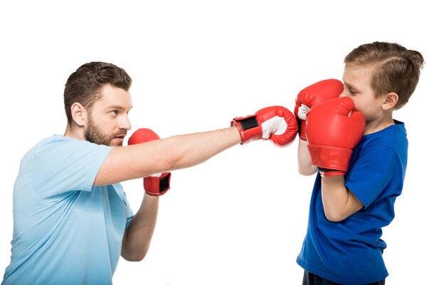 father with son during boxing training 
