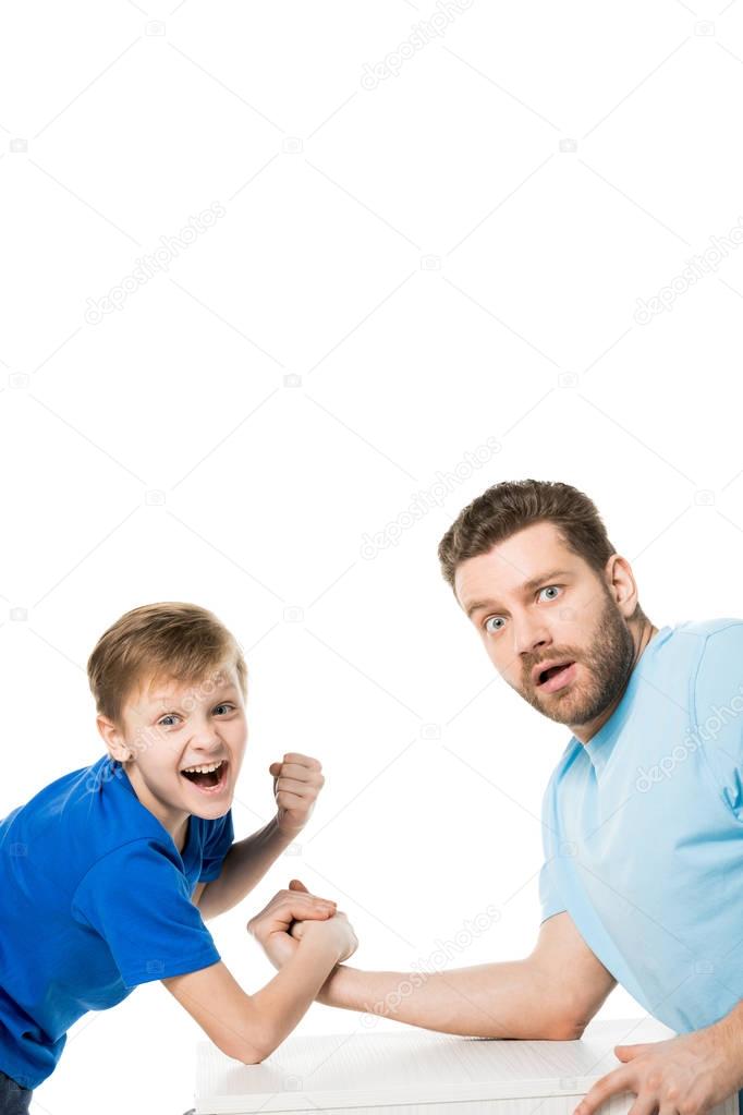 Son with father arm wrestling