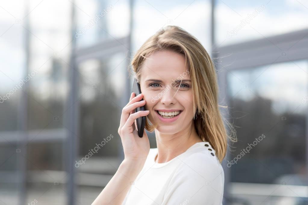 smiling woman with smartphone