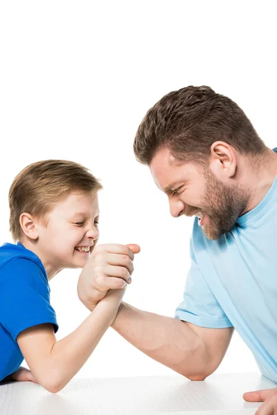 Son with father arm wrestling — Stock Photo