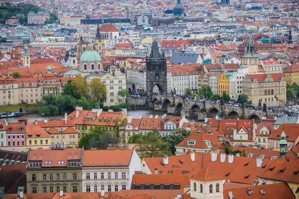 Telephoto aerial view from Petrin Hill to the red roofs of the old city of Prague