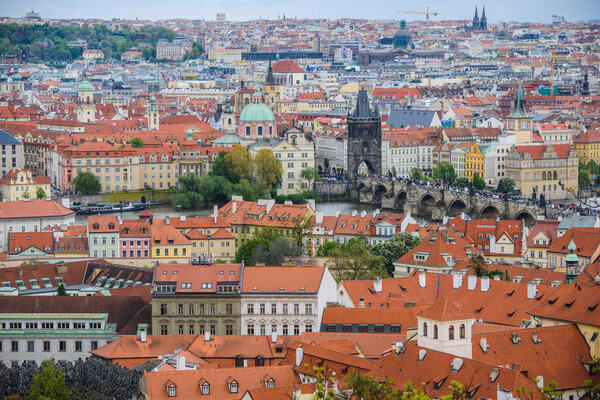 Telephoto aerial view from Petrin Hill to the red roofs of the old city of Prague