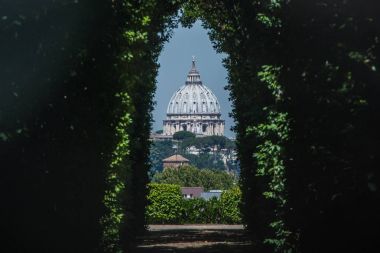 The dome of Saint Peters Basilica seen through the famous keyhole at the the gate of the Priory of the Knights of Malta on Aventino Hill. Rome, Italy, Southern Europe clipart