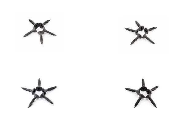 4-sterren aangelegd met zwarte schroeven op witte achtergrond — Stockfoto