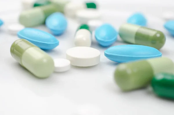 Blue and green pills — Stock Photo, Image