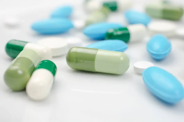 Blue and green pills — Stock Photo, Image