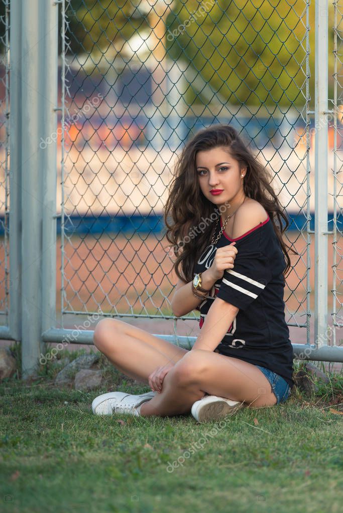 A young bright teen girl loves sports.street fashion of contemporary ...