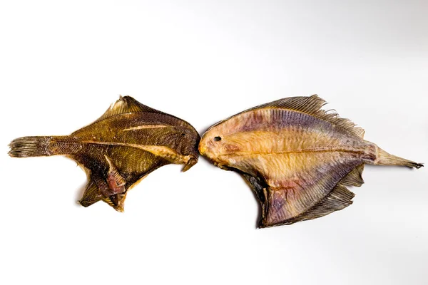 Szárított lepényhal hazugság egy fehér háttér — Stock Fotó