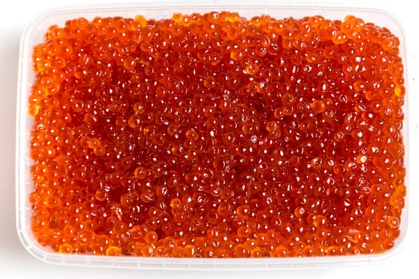 Röd kaviar lax i en burk på en vit bakgrund — Stockfoto