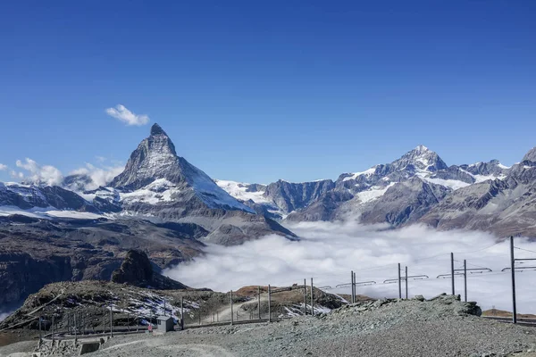 Beautiful iconic mountain Matterhorn with clear blue sky and mis