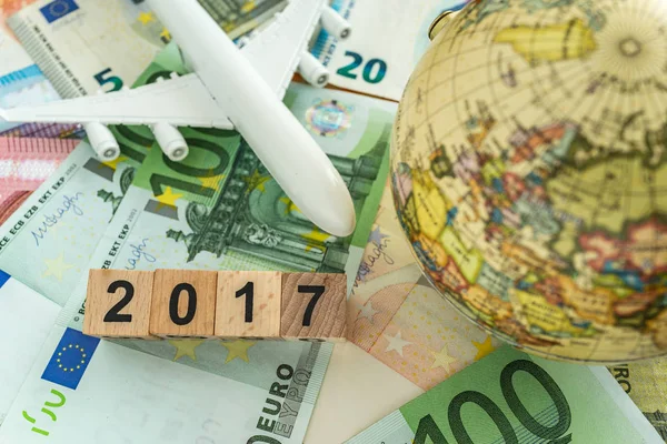 World europe travel concept as toy airplane and globe on pile of — Stock Photo, Image