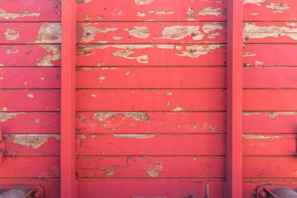 Aged vintage peeling red paint wooden wall as background — Stock Photo, Image