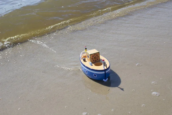 Toy ship floats in water.