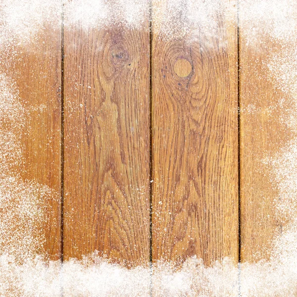 Frame of fallen snow on a wooden surface — Stock Photo, Image