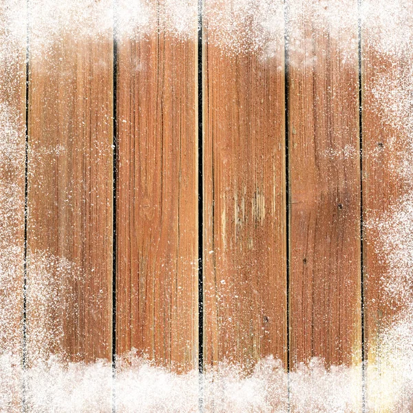 Quadro de neve caída em uma superfície de madeira — Fotografia de Stock