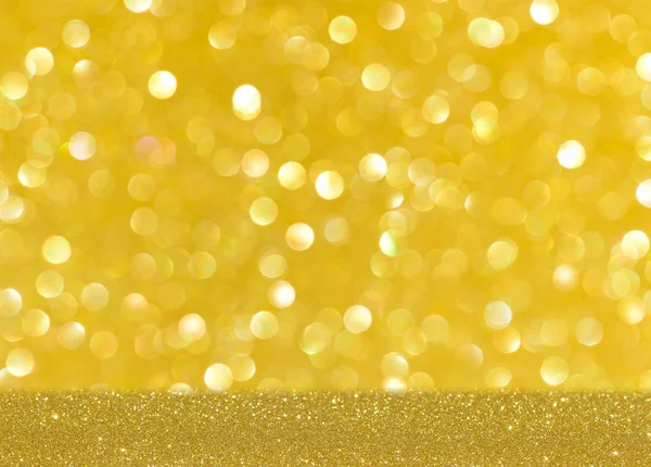 Ouro brilhante borrão brilho fundo — Fotografia de Stock
