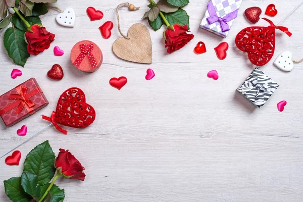 Wooden white background with red hearts, gifts and roses. The concept of Valentine Day — Stock Photo, Image