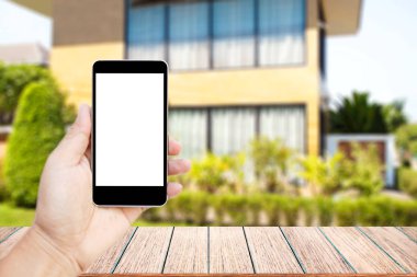 Görüntü siyah cep telefonu boş beyaz ekran ile tutarak el kadar alay