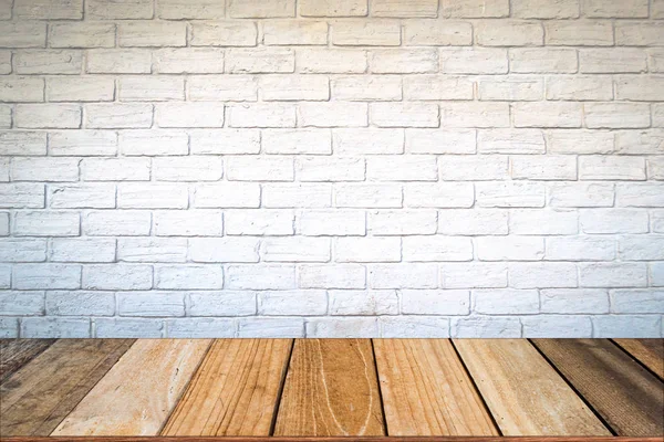 Empty wood table top and brick background with copy space.