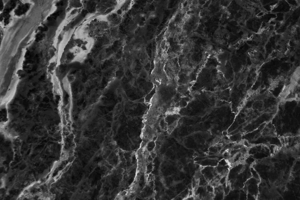 Narin damarlar ile siyah mermer doku, arka plan veya arka plan için doğal desen, Ayrıca mimari levha, seramik zemin ve duvar karoları yüzey etkisi oluşturmak kullanılabilir.