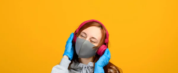 Portrait Girl Mask Which Puts Rubber Glove Yellow Background — Stock Photo, Image