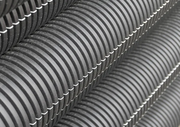 Black corrugated pipes detail — Stock Photo, Image