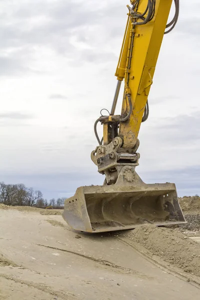 Excavator shovel and construction site — Stock Photo, Image