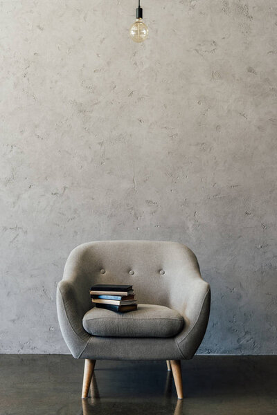 Grey armchair in empty room 