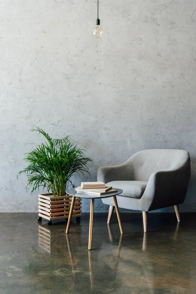 Grey armchair in empty room — Stock Photo, Image