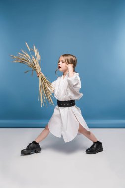 Little girl with wheat ears  clipart