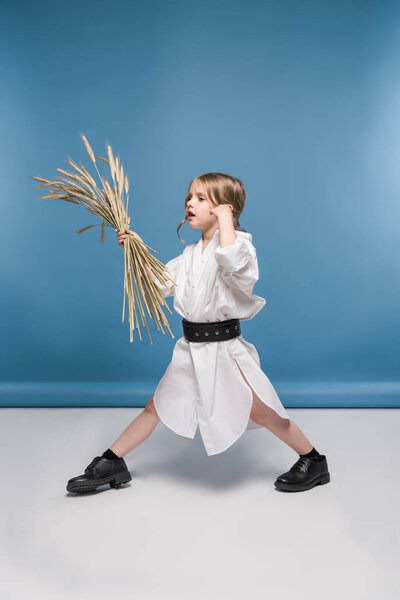 Little girl with wheat ears 