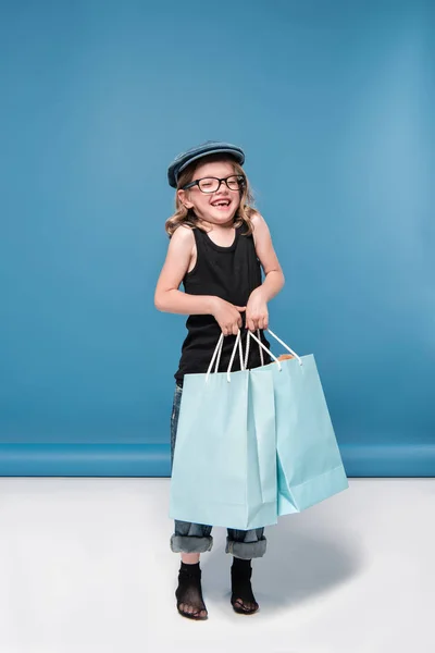 Little girl holding shopping bags — Stock Photo, Image