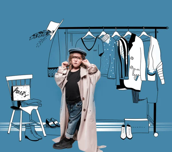 Stylish girl choosing clothes — Stock Photo, Image